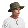 A camo wide-brim bucket hat with a chin strap, featuring shades of green and brown. It has a logo on the side.