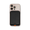A mobile phone in a pink case with a black wallet attached to the back. The wallet features a logo.