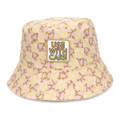 A pink and yellow patterned bucket hat featuring an embroidered patch. The design includes heart shapes and has a logo.