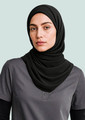 A black women's hijab draped elegantly over a model wearing a grey polo shirt. The image features subtle branding.