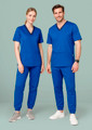 A pair of models wearing matching blue scrub tops and slim-leg jogger scrub pants, featuring branding.