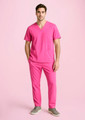 Unisex pink scrub pants featuring a slim fit and pockets, paired with a matching pink top.