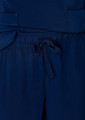 Navy blue women's straight leg scrub pants featuring a drawstring waist and pockets. Branding is present on the fabric.