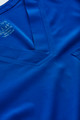 A V-neck scrub top in a vibrant blue colour, featuring a pocket and a logo.