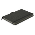 A dark green notebook with a textured cover, featuring an elastic band and a ribbon bookmark. It has a logo on the front.