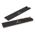 A metal pen with a sleek gold finish, displayed within a black case featuring branding.