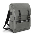 A grey backpack with a flap closure, zippers, and black accents, featuring straps and a branding logo.