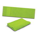 A vibrant green towel, both folded and laid out flat, featuring a subtle branding logo.