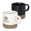 A set of two coffee mugs featuring a white mug with a beige base and a black mug with a beige base. Each has a logo.