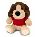 A plush dog toy with brown and cream fur, wearing a red shirt and sitting upright. It has large, expressive eyes.
