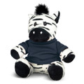 A black and white zebra plush toy wearing a navy-blue top, featuring a friendly expression and soft texture.