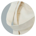 A cream canvas tote bag with sturdy straps, featuring a seamless design and soft texture.