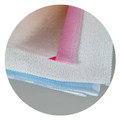 A stack of soft beach towels in pastel colours, featuring a logo on one of the towels.