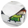 A vibrant, full-colour tea towel featuring playful cartoon designs, predominantly in white, green, and yellow shades.