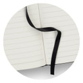 A black Petros Stone Paper Notebook with blank, lined pages and a black ribbon bookmark.