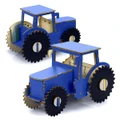 A wooden model of a blue tractor with black wheels, featuring a simple design and a visible internal structure.