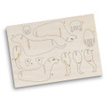 A wooden model kit featuring dog parts, with laser-cut outlines on a light wooden board.
