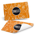 A full colour orange place mat featuring fruit illustrations, with a logo prominently displayed in the centre.