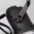 A black Dynamo Solar Torch featuring a foldable handle and a lanyard attachment.