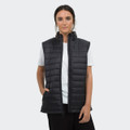 A woman is wearing a black puffer vest over a white t-shirt, featuring a logo and zip-up design.