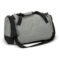 A grey duffle bag with black accents, featuring dual handles and a removable shoulder strap. It has a logo on the side.