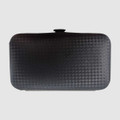 A black manicure set case with a textured surface, featuring a secure closure and compact design.