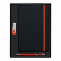 A stationery gift set featuring a black notebook with orange accents, an orange pen, and a USB flash drive.