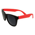 Retro sunglasses featuring black frames and vibrant red arms. The lenses are dark and offer a classic style.