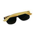 Sunglasses with black lenses and a bamboo-coated frame, featuring a logo on one side.