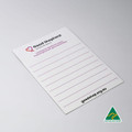 A white magnetic whiteboard featuring lined sections and a logo in the corner. It has a smooth, glossy finish.