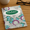 A5 colouring book featuring intricate floral designs in purple, blue, and green, with a logo on the cover.