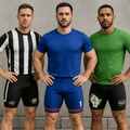 Three men standing side by side, each wearing fitted sports shorts in black and white, blue, and green with branding.