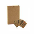 Eco-friendly playing cards spread out next to a brown cardboard box, featuring a simple design and natural colours.