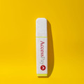 An eco-friendly highlighter in white with a yellow end, featuring a logo on a bright yellow background.