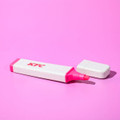 A pink eco-friendly highlighter with a white speckled casing and a removable cap, featuring a logo.