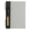 A recycled journal book in grey with a black spiral binding and a pen attached. It features branding on the cover.