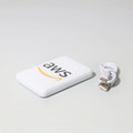A white powerbank with a logo and a small USB cable beside it.