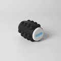 A black Whirl Popper Spinner featuring a white top with a logo, designed as a novelty item for fun and games.