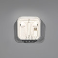 A set of white USB Type C earphones in a clear case, featuring a charging connector.
