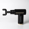 A black massage gun with a unique hook attachment, featuring a branded logo and a sleek design.