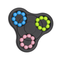 A tri-coloured puzzle game in black, featuring blue, green, pink, and violet spheres arranged in circular patterns.