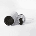 A drink bottle with a silver exterior, a clear lid, and a reusable straw lies on a white surface.