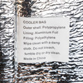 A cooler bag with a shiny metallic exterior, made from polypropylene and aluminium foil, featuring care instructions.