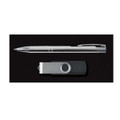 A silver pen and a gray flash drive on a black background, featuring a logo on the flash drive.