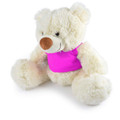 A plush teddy bear in cream with a pink shirt, featuring soft fur and a friendly expression.