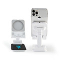 A white phone stand with a circular holder and a square base featuring a logo, supporting a smartphone.