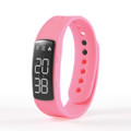 A pink Endurance Pedometer MKII with a digital display showing step and calorie counts.