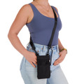 A black neck pouch worn crossbody, featuring multiple pockets, with a model dressed in casual attire.
