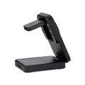 A black, multi-functional charger with a stand, featuring USB ports and a wireless charging pad.