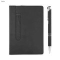 A black Finch notebook with a pen beside it, featuring a sleek design and a pocket for storage.